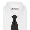 View 2 of product The Turnbull & Asser Slim Black Twill Silk Tie is neatly rolled on a white background, offering an ideal smart finish when paired with cotton shirts.