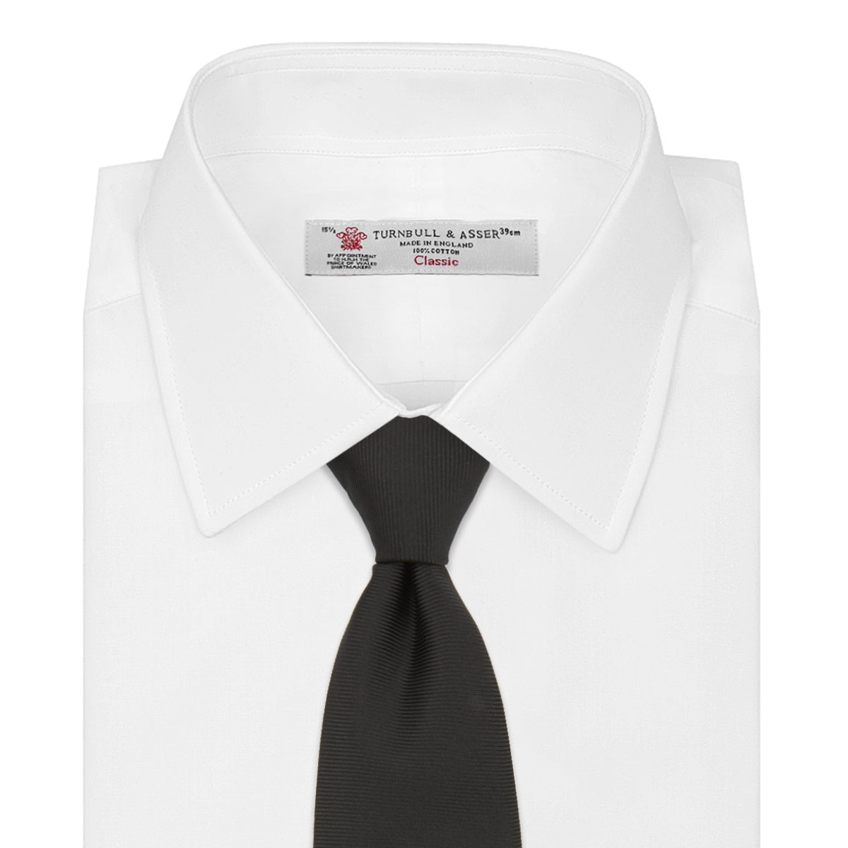View 2 of product The Turnbull & Asser Slim Black Twill Silk Tie is neatly rolled on a white background, offering an ideal smart finish when paired with cotton shirts.