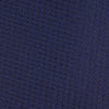 View 3 of product The Turnbull & Asser Navy Lace Silk Tie, featuring a subtle lace weave texture, is displayed rolled up on a plain white background.