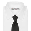 View 2 of product The Turnbull & Asser Slim Black Herringbone Silk Tie is neatly rolled, showcasing its subtle weave on a plain white background.