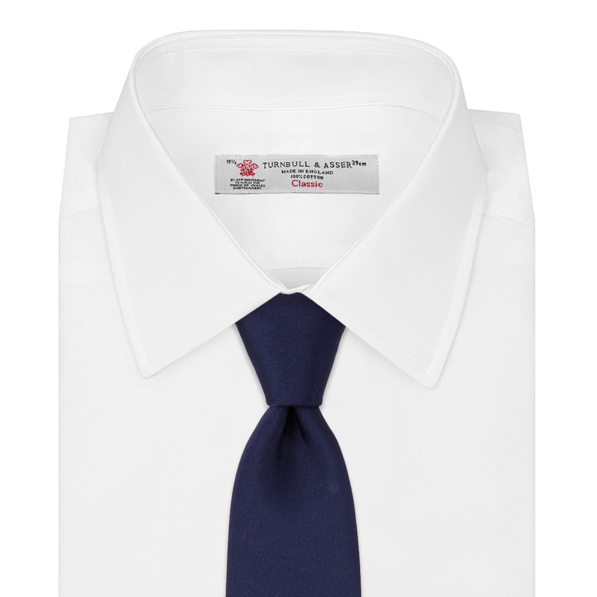View 2 of product The Turnbull & Asser Navy Plain Satin Silk Tie is neatly rolled and set against a white background, making it an ideal accessory for smart dress occasions.