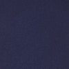 View 3 of product The Turnbull & Asser Seven-Fold Navy Plain Satin Silk Tie is neatly rolled and showcased against a plain light gray background.