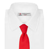 View 2 of product A Red Plain Satin Silk Tie by Turnbull & Asser is neatly rolled and displayed against a plain light gray background.