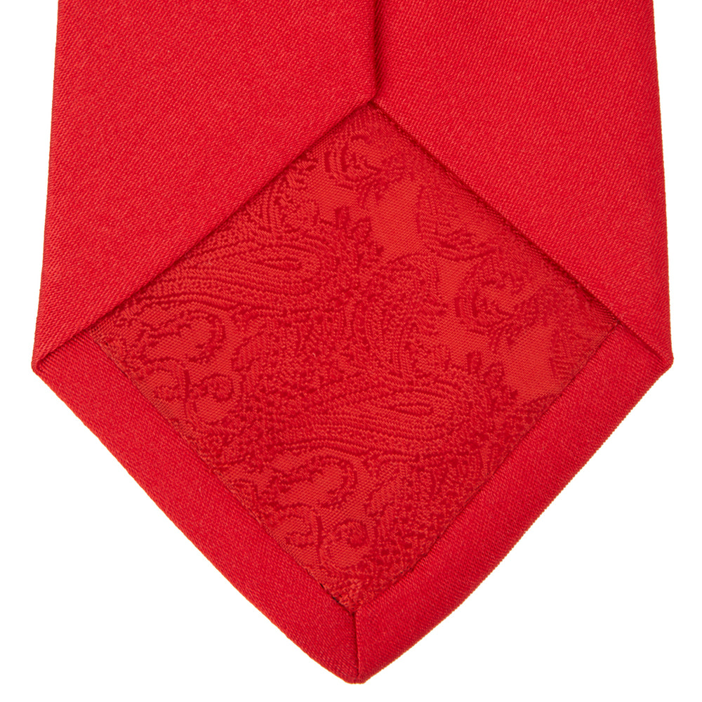 A Red Plain Satin Silk Tie by Turnbull & Asser is neatly rolled and displayed against a plain light gray background.