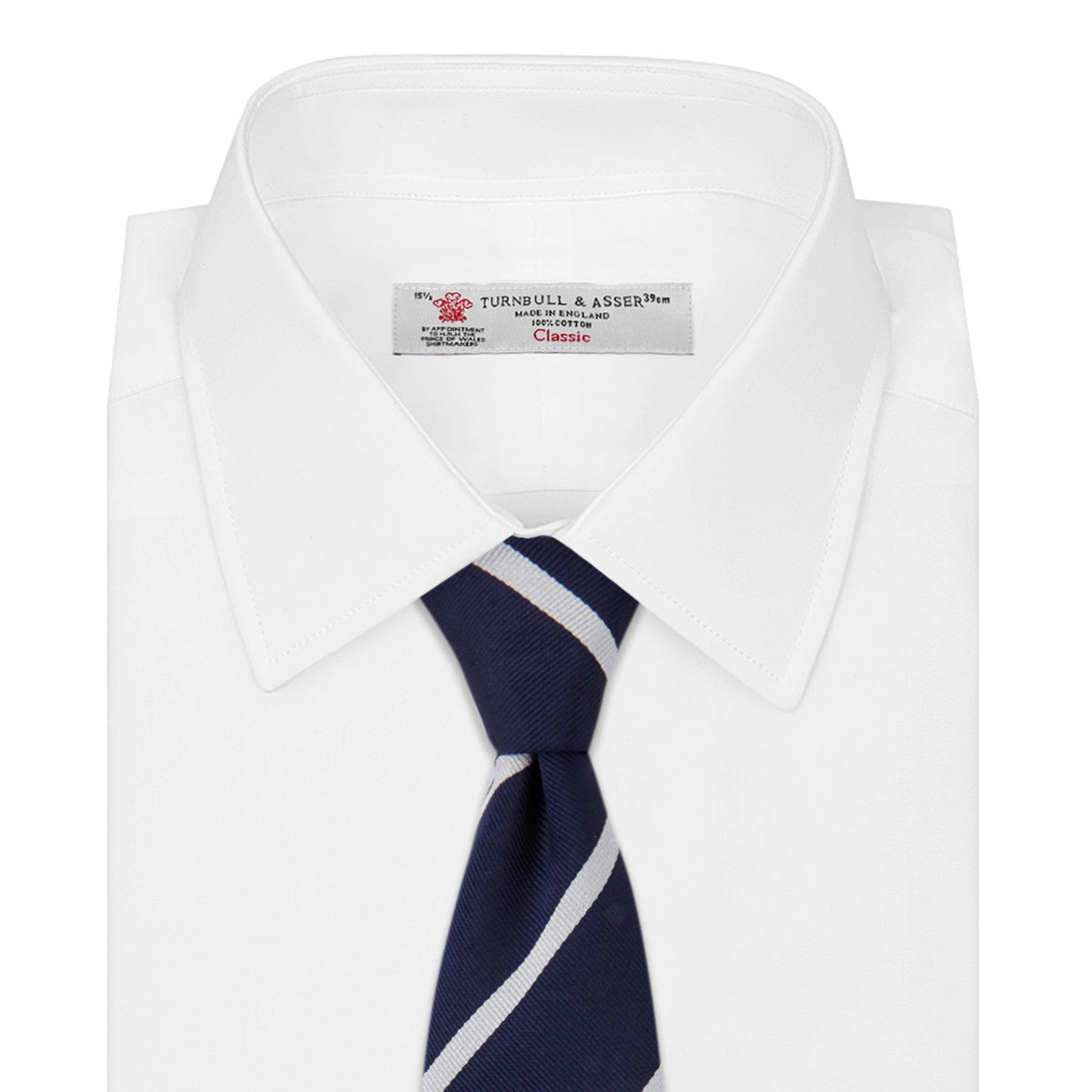 View 2 of product The Turnbull & Asser Navy and White Blazer Stripe Repp Silk Tie is shown rolled up on a plain white background—an ideal accessory to complement any office shirt.