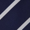 View 3 of product The Turnbull & Asser Navy and White Blazer Stripe Repp Silk Tie is shown rolled up on a plain white background—an ideal accessory to complement any office shirt.