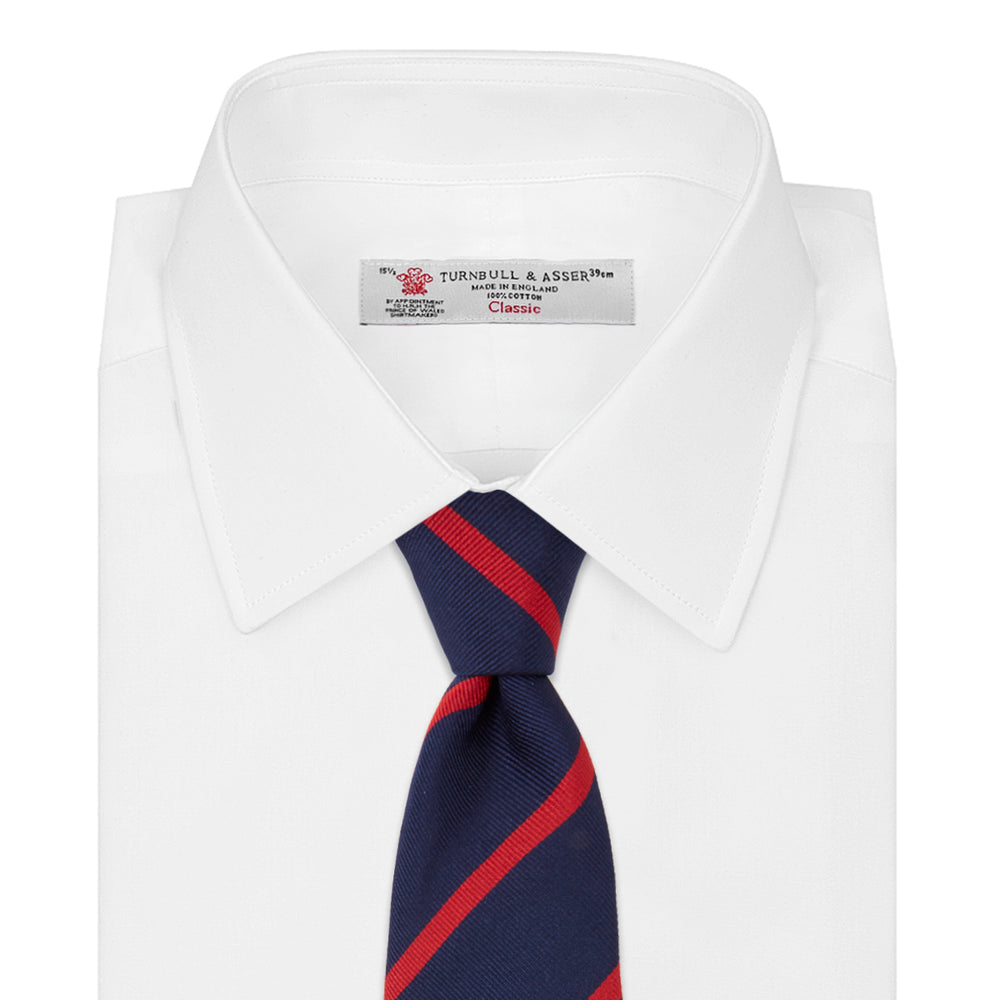 The Navy and Red Blazer Stripe Repp Silk Tie by Turnbull & Asser is a classic accessory, ideal for a timeless schoolboy look or to complement any sharp office shirt.