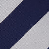 View 3 of product The Turnbull & Asser Navy and Off-White Block Stripe Repp Silk Tie features wide diagonal stripes, ideal for pairing with an office shirt against a plain light background.