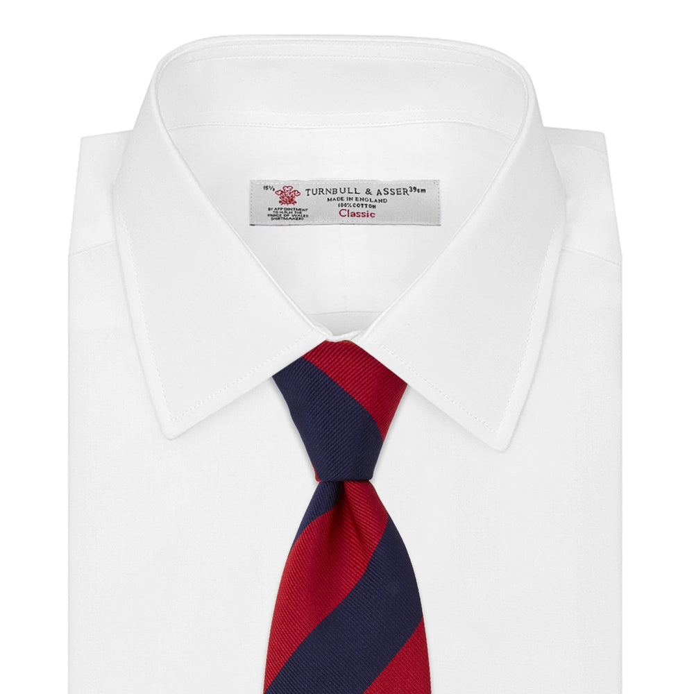 The Turnbull & Asser Long Navy and Red Block Stripe Repp Silk Tie features bold diagonal stripes on white—an ideal office shirt companion.