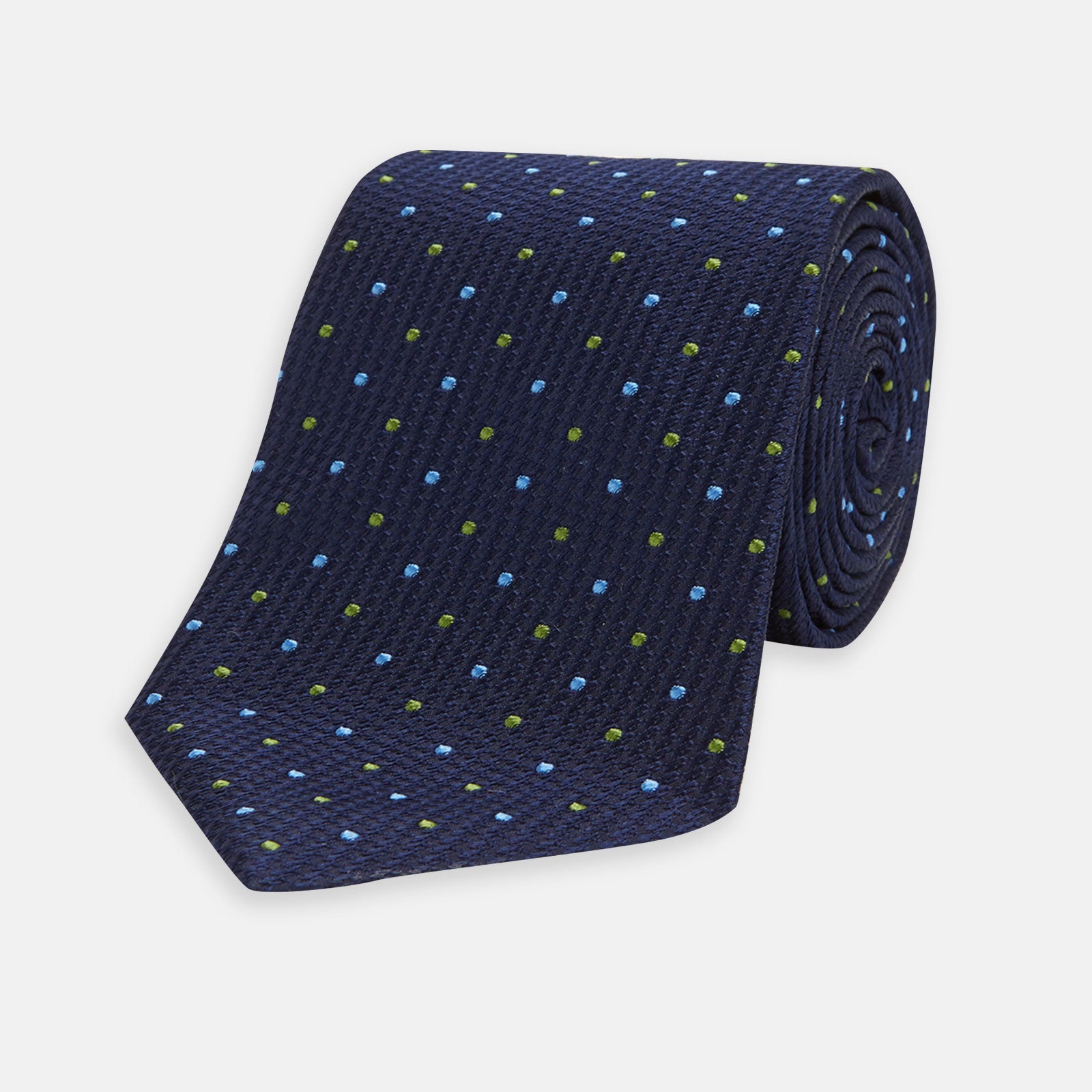 View 1 of product The Turnbull & Asser Navy, Blue & Green Spot Lace Silk Tie features small, evenly spaced blue and green spots—perfect for adding a refined touch to your favorite office shirt.