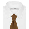 View 2 of product The Gold Knitted Silk Tie by Turnbull & Asser, featuring a textured pattern, is elegantly displayed on a plain white background.