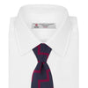 View 2 of product The Turnbull & Asser Navy and Red Striped Zigzag Silk Tie, featuring a striking pattern, is elegantly rolled on a white background—ideal for the modern gentleman.