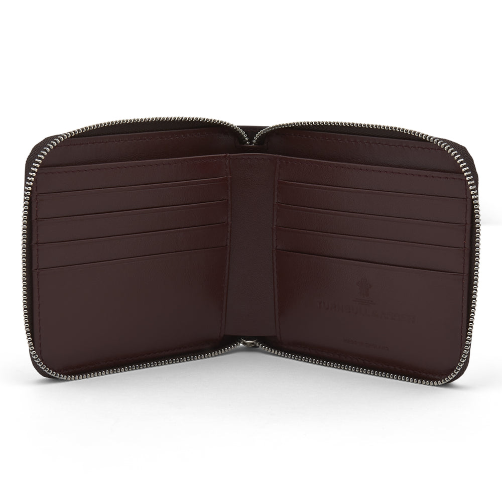 The Violla Leather 8 C/C Zipped Wallet by Turnbull & Asser features a dark brown, square design with multiple card slots and an embossed logo—ideal for everyday use.