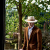 View 3 of product The Turnbull & Asser Tobacco Plainweave Cashmere Jacket is a single-breasted brown summer jacket with two buttons, notch lapels, and flap pockets, tailored in Italy and shown on a plain white background.