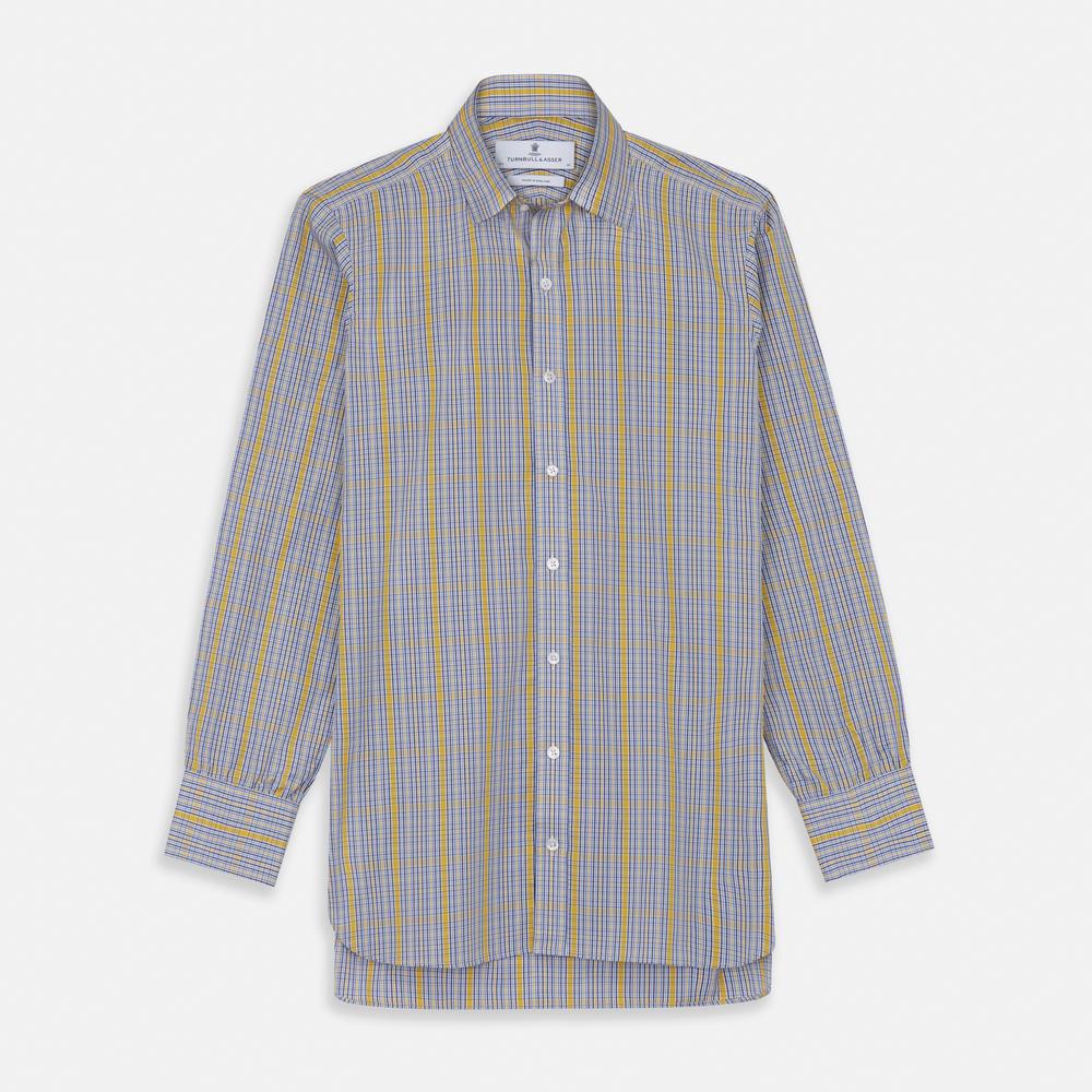 A close-up of Turnbull & Asser's Yellow & Blue Check Cotton Fabric shows its plaid pattern, with intersecting lines in yellow, blue, white, and light brown, displayed in a circular frame on a plain white background.