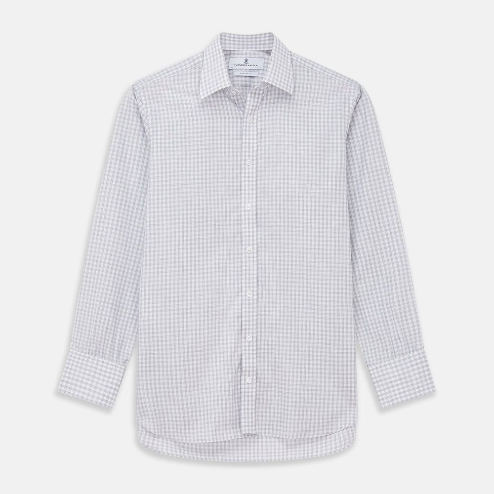 Close-up of Turnbull & Asser’s Grey Check Cotton Fabric, featuring a light gray and white plaid pattern in a circular frame that highlights the smooth texture and crisp intersecting lines.