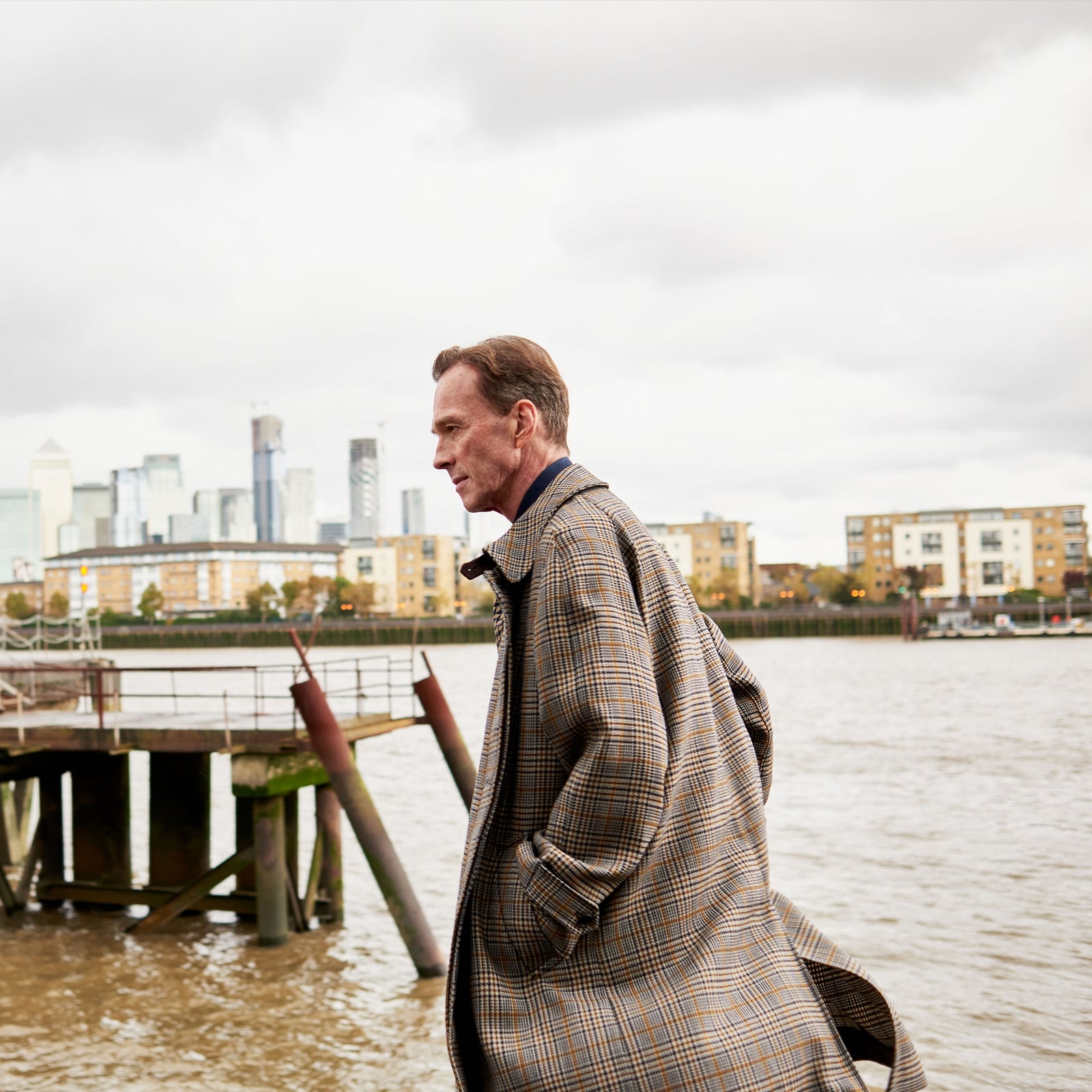 View 2 of product The Turnbull & Asser Checked Wool Car Coat features a straight-cut silhouette in brown and gray Prince of Wales check, classic collar, concealed front buttons, long sleeves, and a minimalist tailored design.