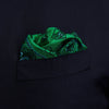 View 2 of product The Green & Blue Double-Faced Paisley Silk Bandana Pocket Square by Turnbull & Asser features a detailed paisley and geometric print with brand accents at the corners.
