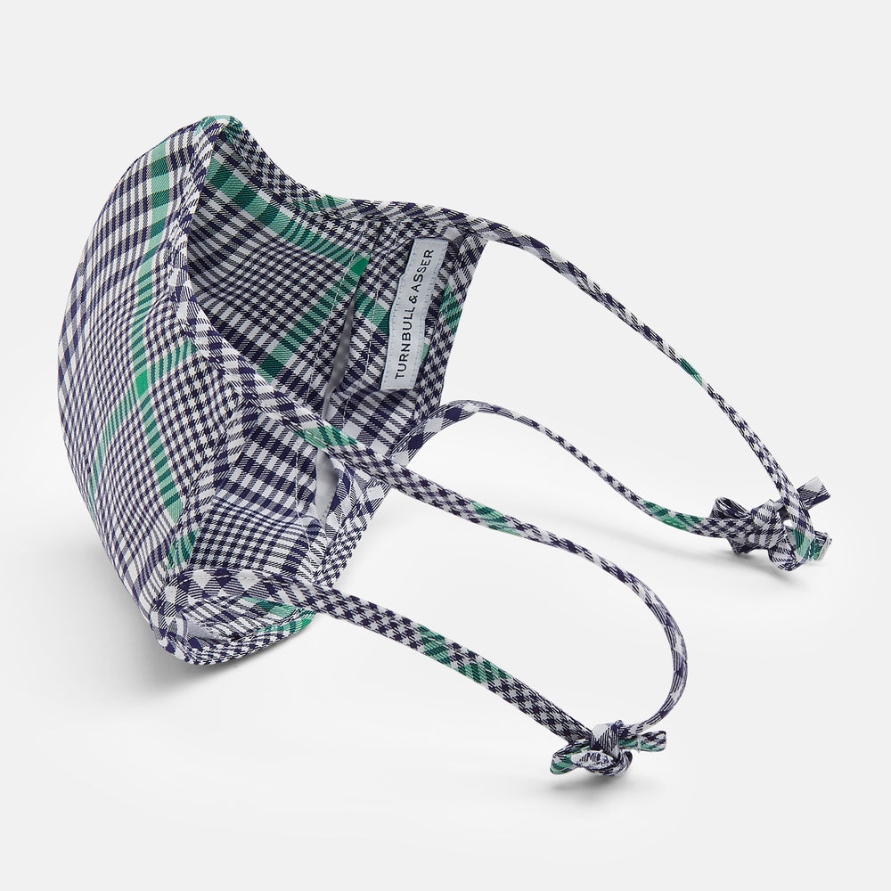 The Turnbull & Asser Exclusive Navy & Green Archive Check Superfine Cotton Commuter Mask features adjustable ear loops with bows and comes with 3 Viroformula™ filters.