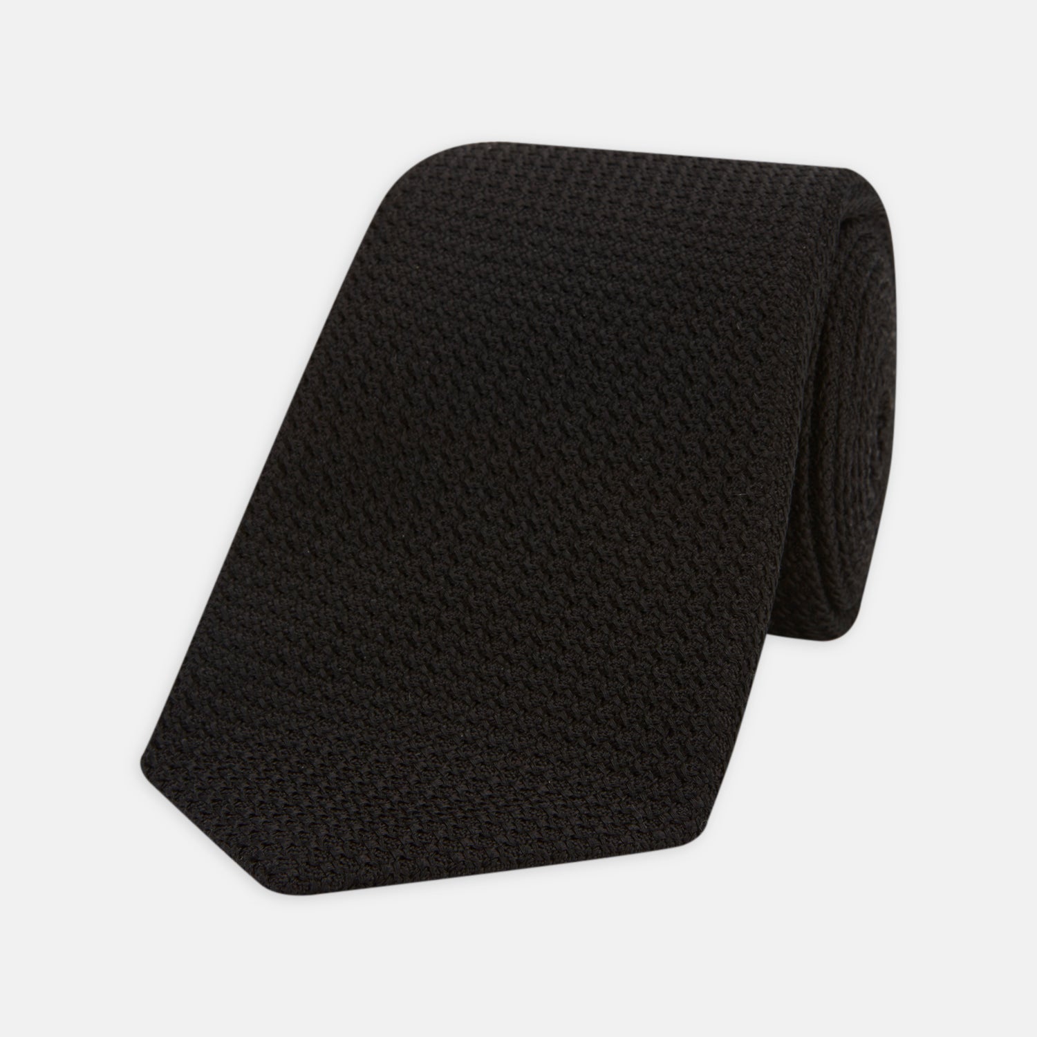 View 1 of product The Turnbull & Asser Seven-Fold Black Grenadine Silk Tie, displayed on a white background, adds a refined touch of luxury neckwear.