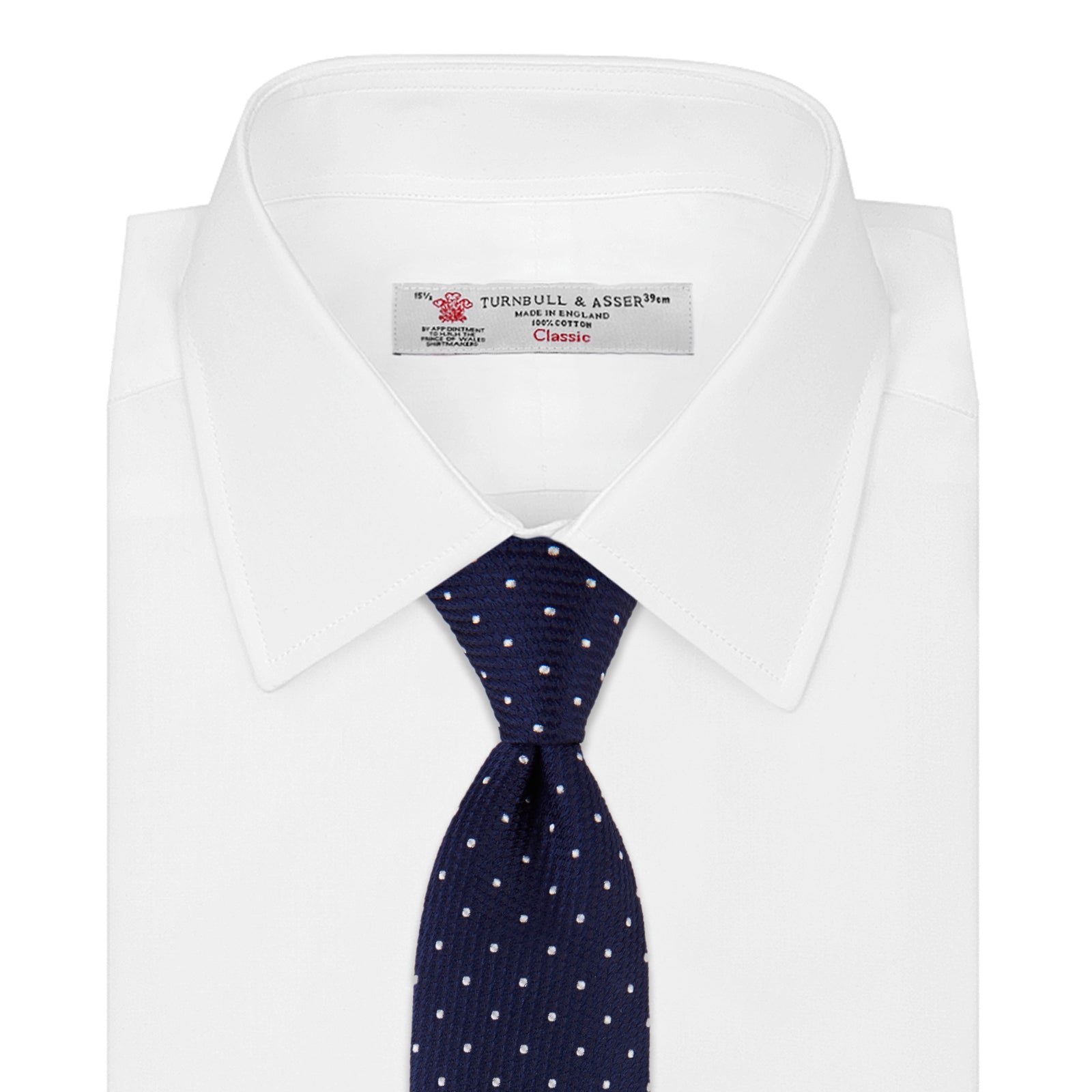 View 2 of product The Seven-Fold Navy and White Spot Lace Silk Tie by Turnbull & Asser showcases a luxurious navy silk with white spots, elegantly rolled and presented on a white background.