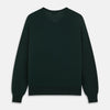 View 3 of product The Turnbull & Asser Forest Green Fine Merino V-Neck Jumper, shown laid flat on a white background, features classic Scottish knitwear details with ribbed cuffs and hem for a timeless look.