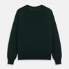 View 3 of product The Turnbull & Asser Forest Green Crew Neck Merino Jumper features ribbed cuffs and hem for a classic look. Laid flat on a white background, this luxury long-sleeve sweater is an essential, timeless addition to any wardrobe.