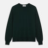 View 1 of product The Turnbull & Asser Forest Green Crew Neck Merino Jumper features ribbed cuffs and hem for a classic look. Laid flat on a white background, this luxury long-sleeve sweater is an essential, timeless addition to any wardrobe.