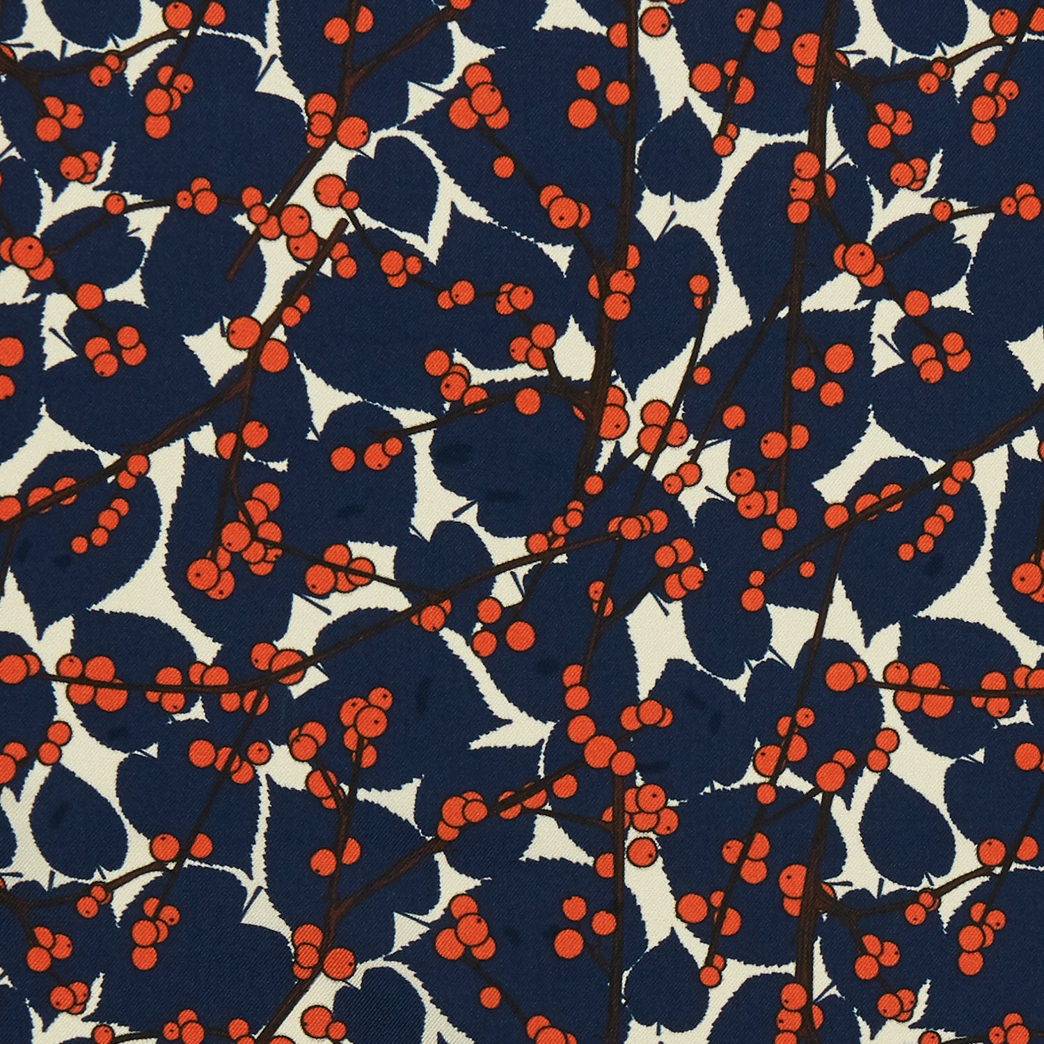 View 2 of product The Blue Berry Floral Pocket Square by Turnbull & Asser features a navy blue silk background with red berry and white leaf designs, plus small labels on two corners—making it a perfect festive gift.