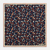View 1 of product The Blue Berry Floral Pocket Square by Turnbull & Asser features a navy blue silk background with red berry and white leaf designs, plus small labels on two corners—making it a perfect festive gift.