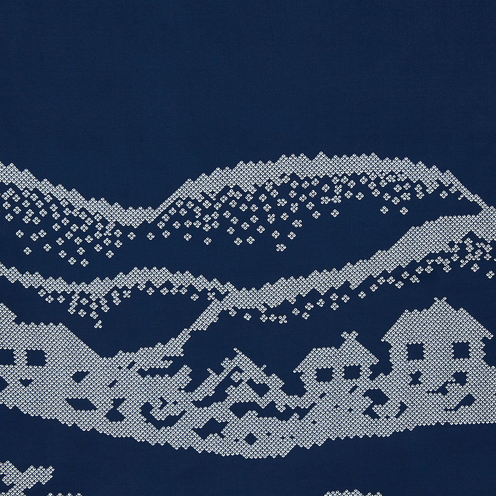 The Blue Snowscape Motif Silk Extra Large Scarf by Turnbull & Asser features a light blue village scene and hand-rolled edges, with TURNBULL AND ASSER at the bottom right and PRINTED IN ENGLAND at the top left.