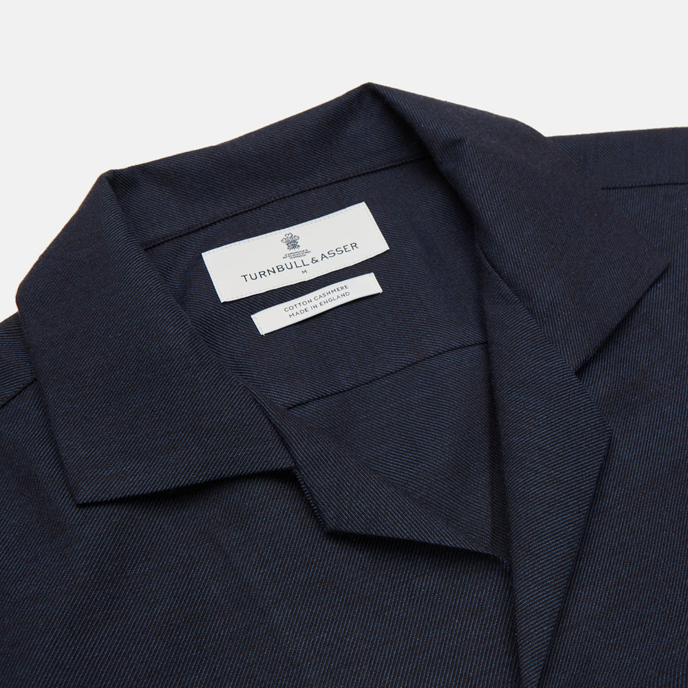 The Turnbull & Asser Holiday Fit Navy Cotton and Cashmere Blend Shirt features 1-button cuffs, a notched collar, and a single chest pocket, shown against a plain white background.