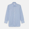 View 1 of product The Turnbull & Asser Light Blue Bengal Stripe Shirt features white vertical stripes, a classic T&A collar, and 3-button cuffs. Buttoned down the front, it’s laid flat on a white background for a timeless British look.