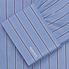 View 5 of product A neatly folded Turnbull & Asser Blue Stripe Regular Fit Shirt with T&A collar and square double cuffs, featuring long sleeves and thin white stripes on a light blue base, displayed on a plain white background.