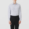 View 2 of product The Turnbull & Asser Navy Stripe Regular Fit Shirt features a T&A collar, square double cuffs, and thin vertical navy stripes on white.