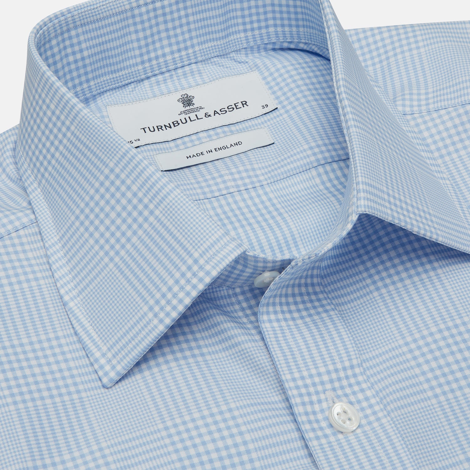 View 4 of product The Turnbull & Asser Pale Blue Check Shirt features a T&A collar, 3-button cuffs, and a subtle tonal check in royal cotton twill. It’s long-sleeved, regular fit, and shown flat on a white background.