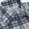 View 4 of product The Turnbull & Asser Blue Check Shirt features a T&A collar and 3-button cuffs, shown laid flat against a white background.
