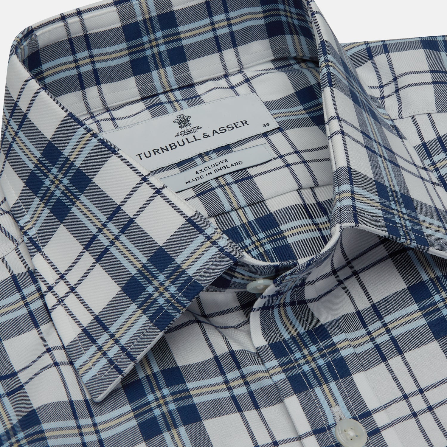View 4 of product The Turnbull & Asser Blue Check Shirt features a T&A collar and 3-button cuffs, shown laid flat against a white background.