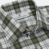 View 4 of product The Turnbull & Asser Green Check Shirt features a classic T&A collar, white buttons down the front and on 3-button cuffs, and a bold green, white, and black plaid pattern.