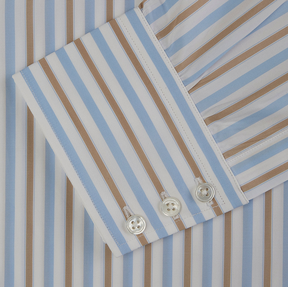 The Turnbull & Asser Blue and Brown Stripe Poplin Shirt features a T&A collar, three-button cuffs, and vertical blue, white, and tan stripes. This smart-casual shirt is displayed on a plain light background.