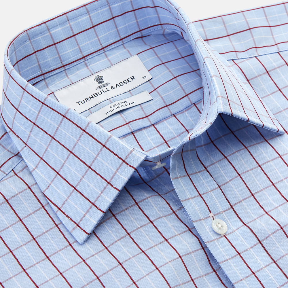 The Burgundy Graph Check Regular Fit Shirt by Turnbull & Asser features a T&A collar, 3-button cuffs, and a check pattern. Laid flat on a white background.