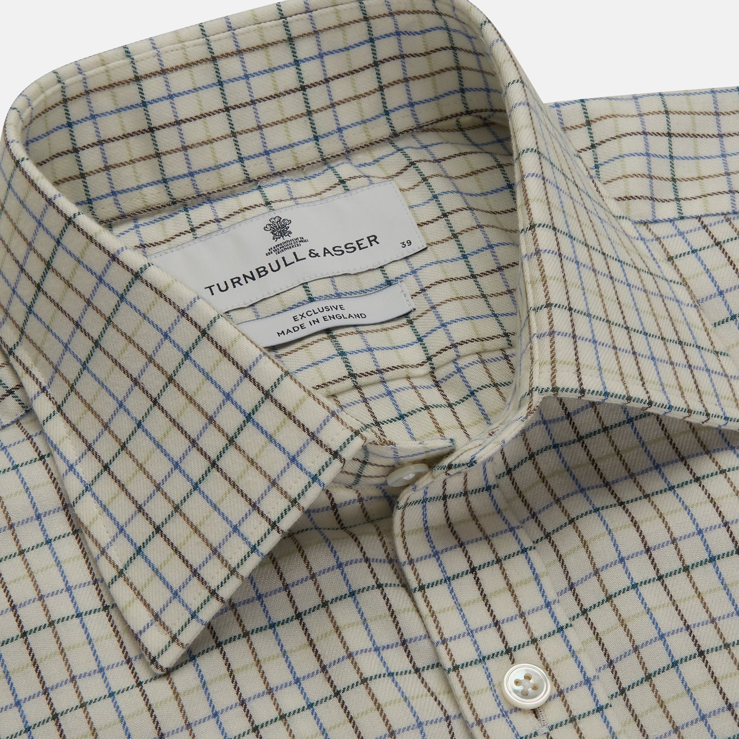 View 4 of product The Turnbull & Asser Green Multi Check Cotton-Cashmere Shirt features a T&A collar, 3-button cuffs, and a tonal green, beige, and blue check pattern. Shown flat against a white background.