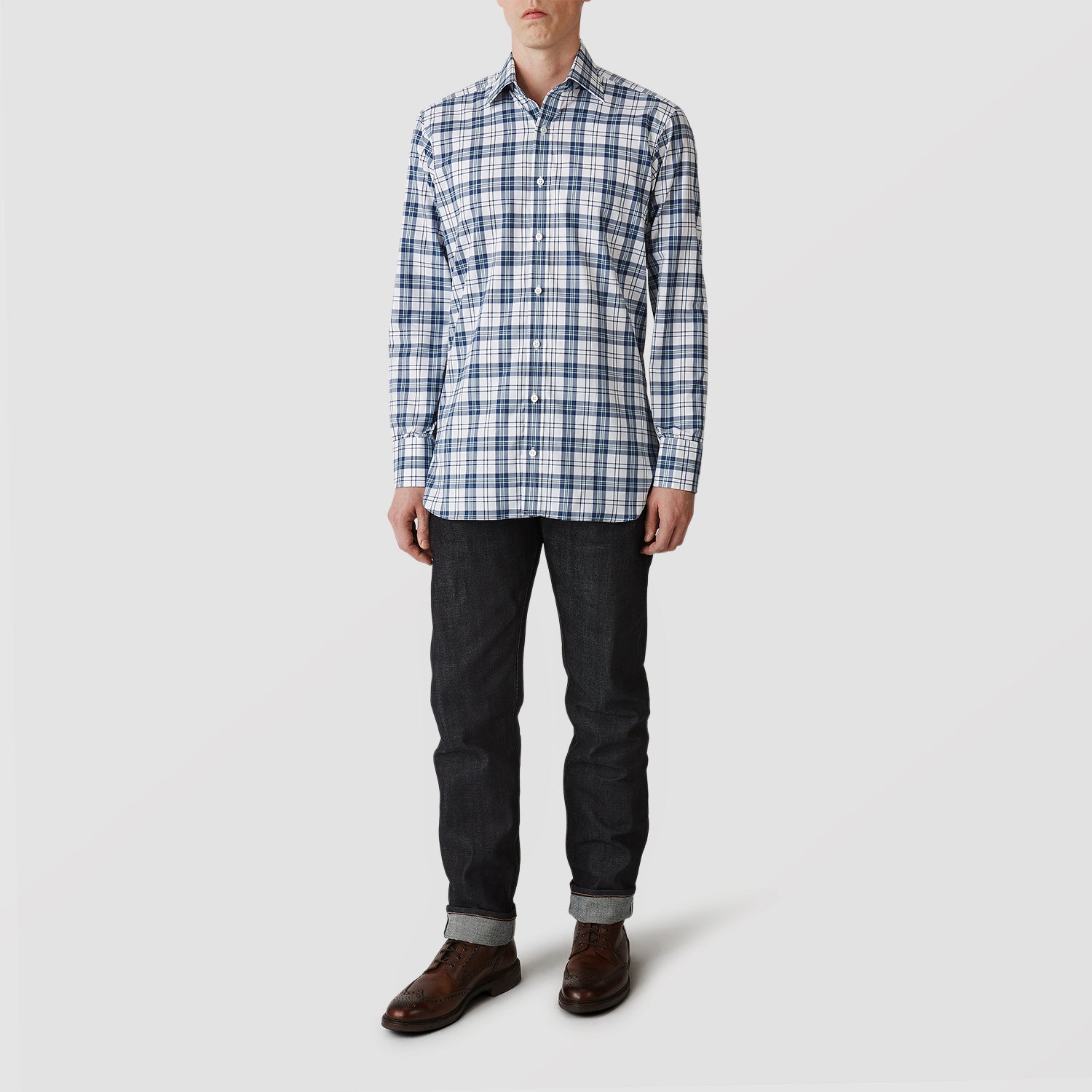 View 2 of product The Turnbull & Asser Blue Check Shirt features a T&A collar and 3-button cuffs, shown laid flat against a white background.
