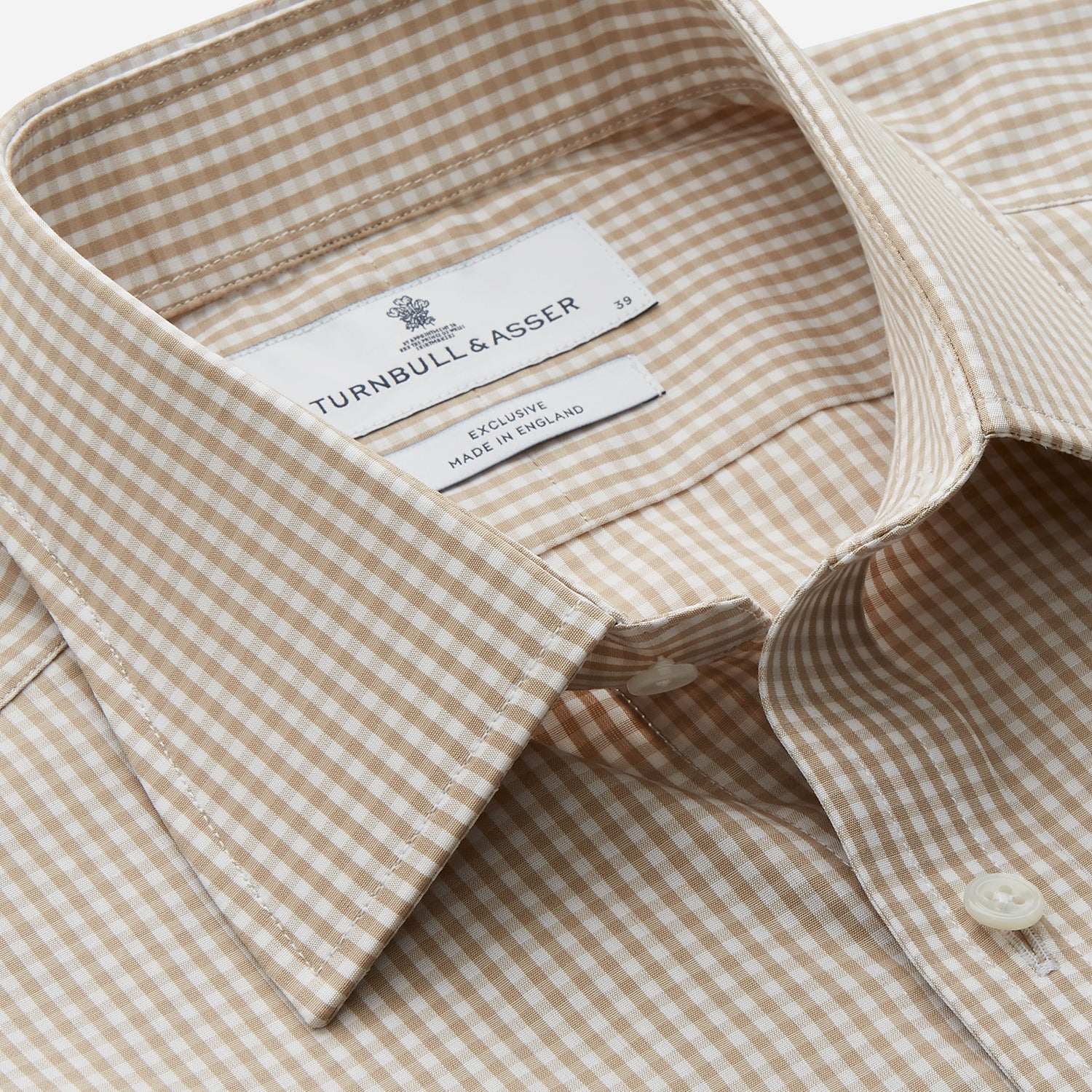 View 2 of product The Sand Gingham Check Regular Fit Shirt by Turnbull & Asser features a T&A collar, 3-button cuffs, and a sand gingham check pattern on white.
