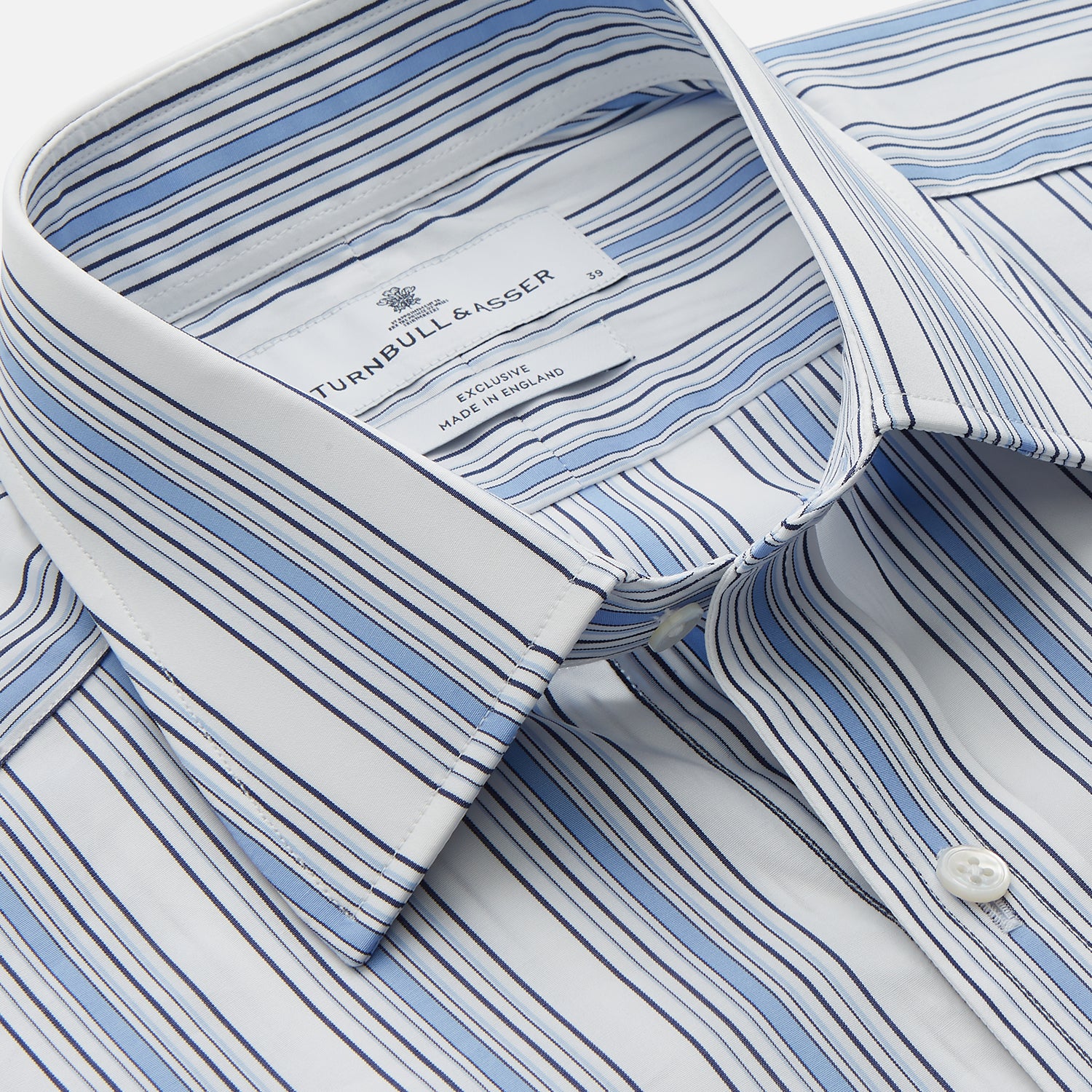View 2 of product The Turnbull & Asser Blue Multi Stripe Regular Fit Shirt features a classic T&A collar, long sleeves, button-down front, and 3 button cuffs. Shown laid flat against a white background.