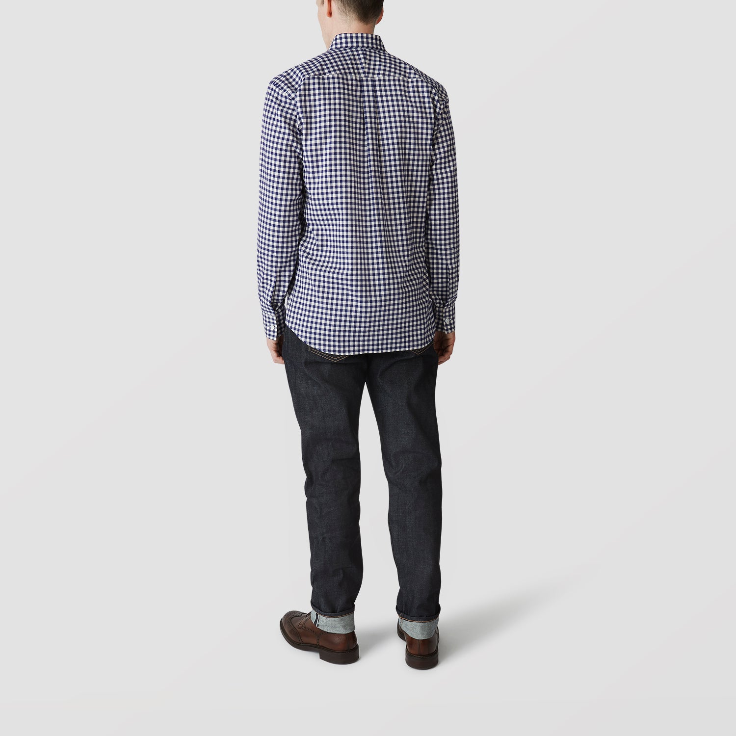 View 3 of product The Turnbull & Asser Blue Check Weekend Fit Shirt features a Derby collar and 1-button cuffs—ideal for winter layering. Shirt is laid flat on a white background.