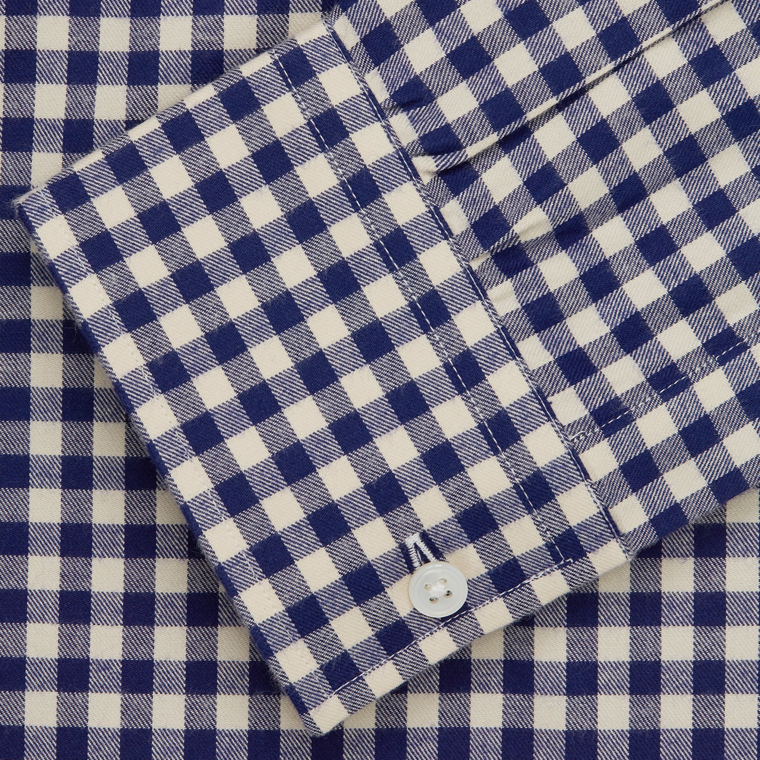View 5 of product The Turnbull & Asser Blue Check Weekend Fit Shirt features a Derby collar and 1-button cuffs—ideal for winter layering. Shirt is laid flat on a white background.