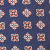 View 3 of product The Turnbull & Asser Burgundy Geometric Jacquard Tie features a bold, playful pattern of red and white dice scattered across its surface.