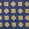 View 3 of product The Turnbull & Asser Yellow Geometric Jacquard Tie in navy features a repeating pattern of yellow geometric shapes with blue accents, presented rolled up on a white background.