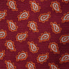 View 3 of product The Turnbull & Asser Red Abstract Paisley Silk Tie features bold orange and white paisley patterns on rich red silk—a stylish choice for fans of classic tailoring.